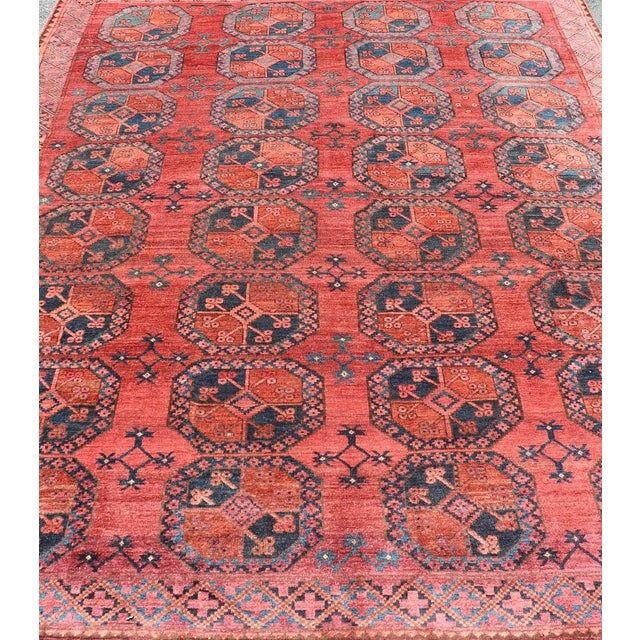 This Turkomen Ersari rug has been hand-knotted in the finest wool. The rug features a repeating Gul design throughout the...