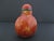 Vintage Chinese simulated realgar glass snuff bottle, featuring vibrant swirling red and yellow glass patterns meant to...