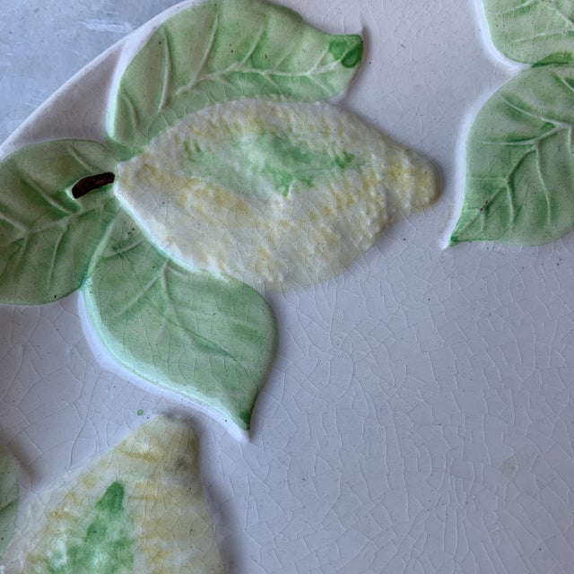 This plate screams summer! Hang as a decorative plate on the wall or use in a vignette. 3D texture through out.