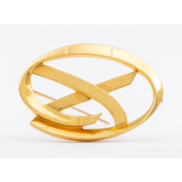 Paloma Picasso for Tiffany and Company 18K Yellow Gold Brooch, oval shaped frame surrounding the Picasso designed "X"...