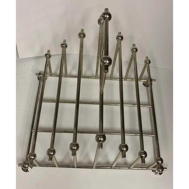 Mid Century Modern 80s Chrome Magazine Holder. Great Modern look! Highly functional. Can hold magazines and or books.