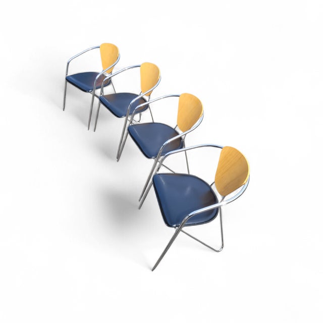 A striking set of four vintage Effezeta dining armchairs, made in Italy and dating to the late 20th century, circa...