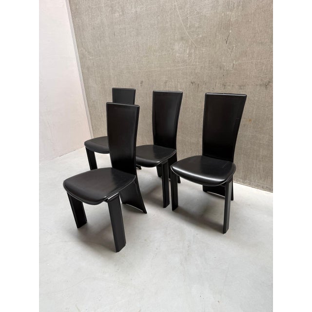 Meet the Postmodern Brutalist Pietro Costantini Dining Chairs. This striking set of four chairs combines sculptural...