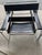 Matching pair of vintage Italian black leather and tubular chrome lounge chairs, dating to approximately the 1980s. The...