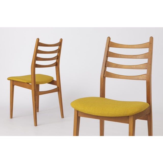 Vintage Dining Chairs from the 1960s These elegant dining chairs from the 1960s feature timeless design and craftsmanship,...