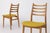 Vintage Dining Chairs from the 1960s These elegant dining chairs from the 1960s feature timeless design and craftsmanship,...