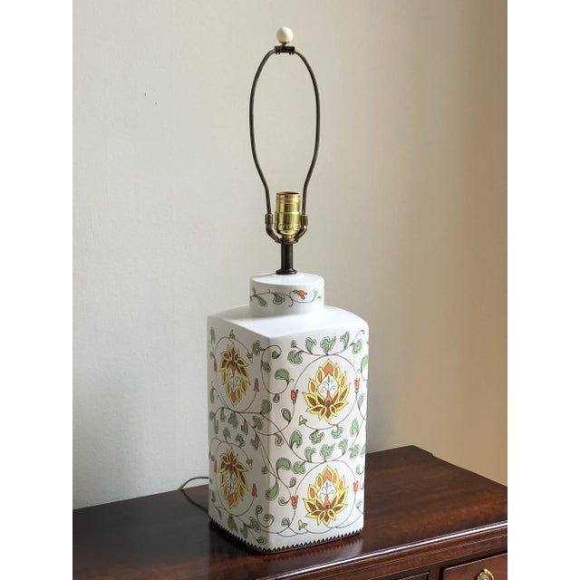 This is such a beautiful lamp! It features a tea jar-shaped base in a soft ivory glaze with a vibrant lotus flower pattern...