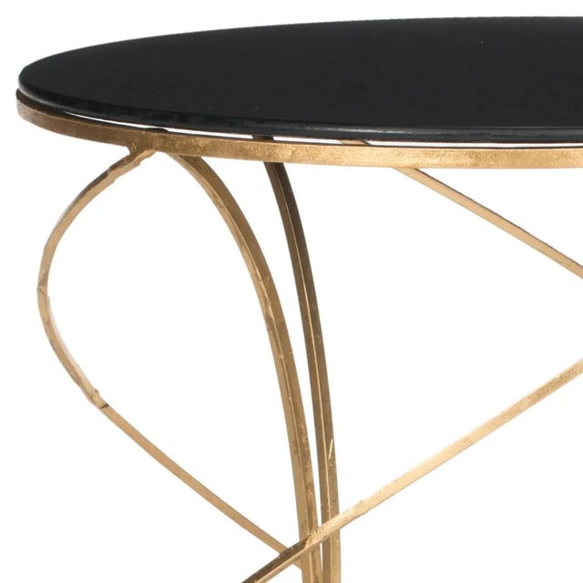 The dynamic curves and chic finish of the Accent Table make it a polished addition to any décor. Crafted with a gold-...