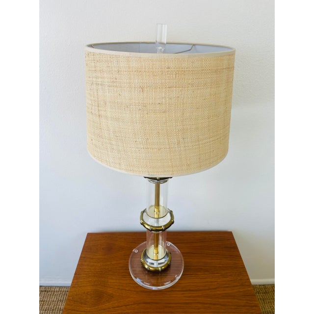 Vintage 1970s Karl Springer Style Lamp clear acrylic & brass faux bamboo rings in the style of Karl springer holds a...