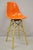 Modernica Orange Fiberglass Eames Style Shell Case Study Dowel Swivel Barstool. Item features an orange fiberglass seat,...