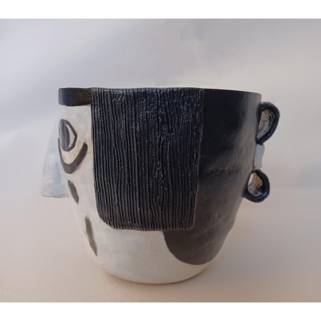 Hand-built ceramic sculptural vessel inspired by the Koshari clowns of Hopi tradition. Bold matte black and matte white...