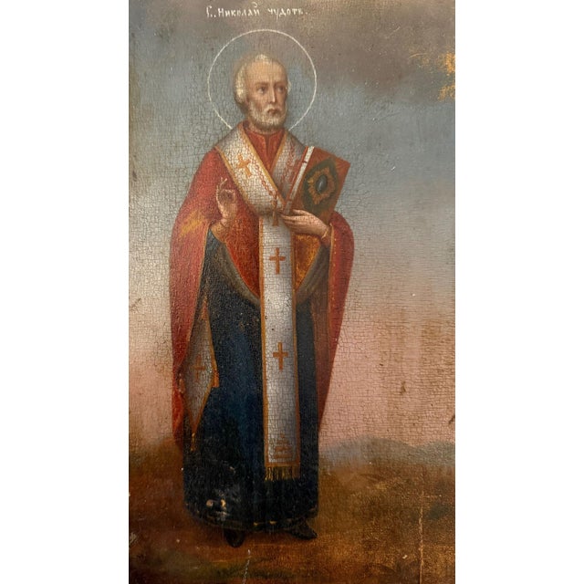 A finely rendered 19th-century Orthodox icon depicting Saint Nicholas the Miracle Worker alongside Venerable Eustolia of...