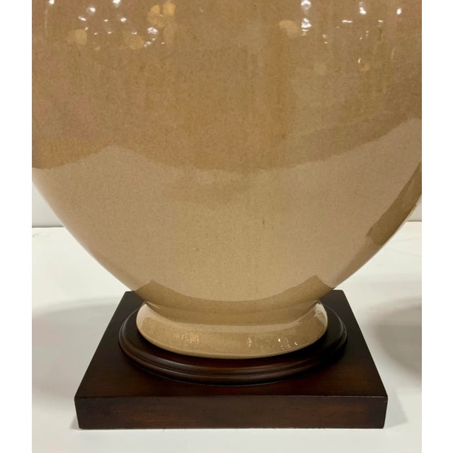 Stylish Modern Taupe Glaze Ceramic Dudley Table Lamps Pair, warm dark wood base, the finish on the base varies slightly,...