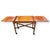 This solid cherry server features a colonial-inspired frame with turned legs, cross-bracing, and smooth caster wheels for...