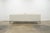 Designed by acclaimed interior designer Martyn Lawrence Bullard for Frontgate, this white leather sofa embodies the...
