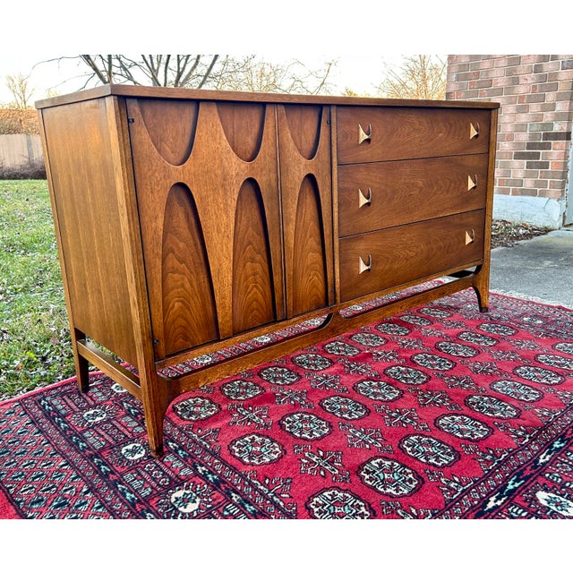 Manufacturer: Broyhill Series: Brasilia When: 1965 Where: USA Materials: Walnut, brass Condition: great condition with...