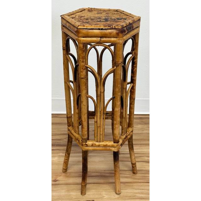 Vintage hexagonal top side table or plant stand in a natural scorched bamboo finish. Nice classic construction with split...
