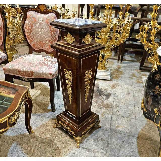 Elevate your interior with this stunning French Rococo style pedestal column, designed with a more geometric and...