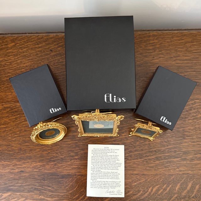 An extraordinary, complete set of three vintage fine gold electroplate picture frames by Elias, complete with original...