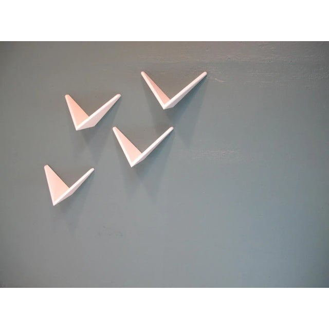 The thickness of the shelves are 2cm. This is a rare version of the famous butterfly shelves made at the 50s in lacquer...