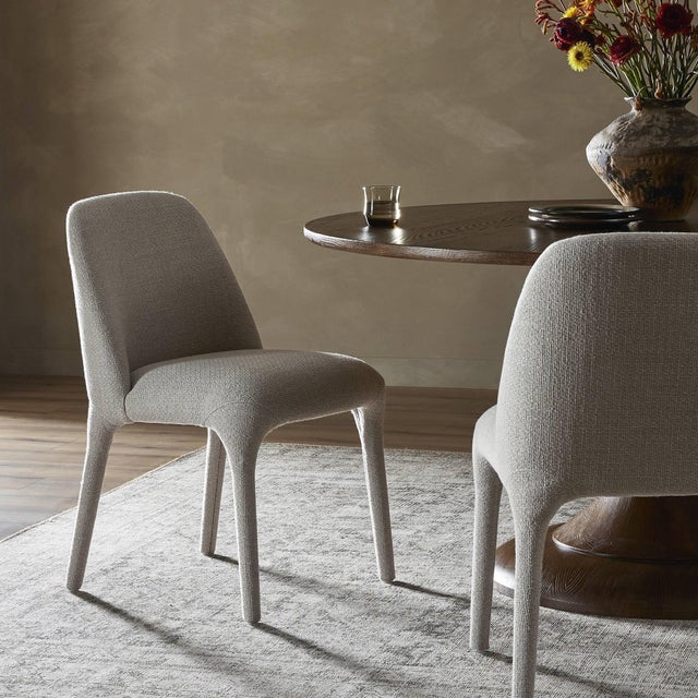 Fully upholstered in an off-white high-performance fabric, this armless dining chair feels simple while sleek. Performance...