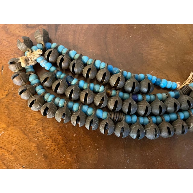 Tribal Long Strand of Brass Bronze Bells Strung With Turquoise Glass Trade Beads For Sale - Image 3 of 13