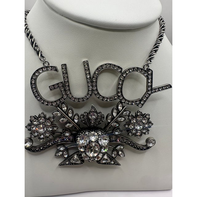 Gucci Crystal "Guccy" Pendant Necklace Silver-Tone Metal & Rhinestone crystals. It comes with the Designer signature...