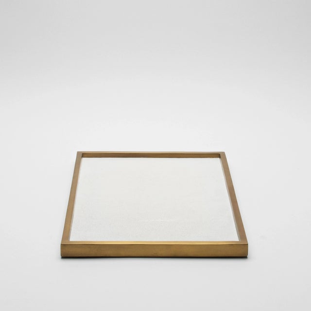 The Rectangular Tray in White Shagreen with Bronze Patina Brass by Kifu Paris is an epitome of understated elegance,...