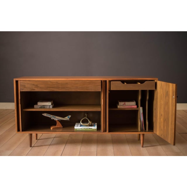 Mid century modern sideboard cabinet credenza in walnut designed by Milo Baughman for Glenn of California, circa 1950's....