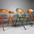 Colourful set of six vintage folding chairs from the 1970s, featuring slender metal frames in yellow, green and orange...