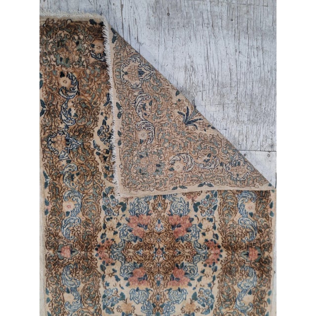 Ciy blue, brown, redrda 1930 Persian Kerman rug , featuring a soft beige background with a center medaillon. Accented in...