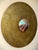 This large scale wall mounted gold mandala features a mirror eye and subtly raised relief, ornaments, and nuanced...