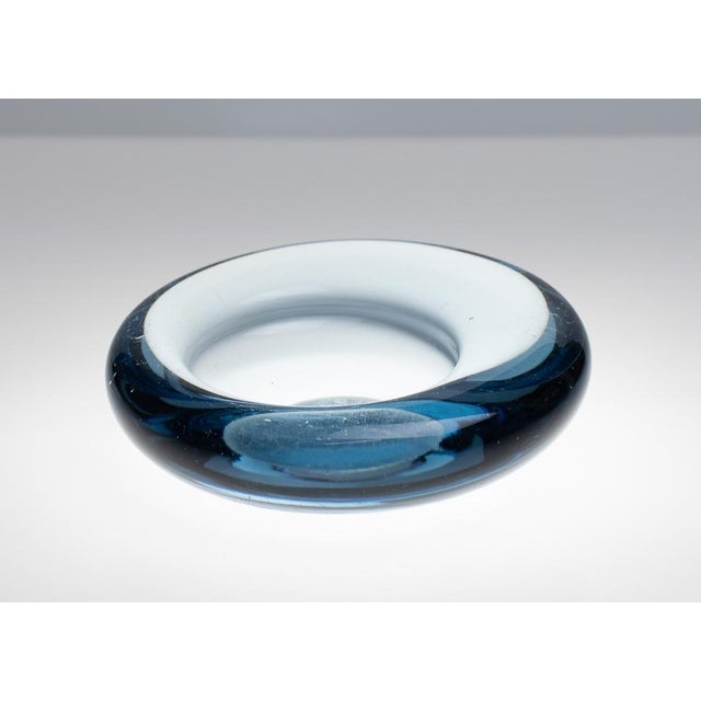 This set consists of two ashtrays from the Akva series from the Danish glass manufacturer Holmegaard. Both were designed...