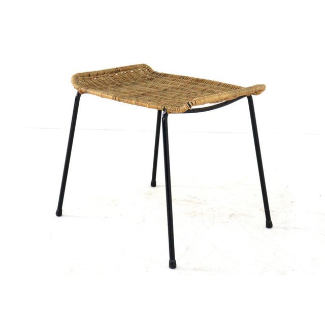 This charming and elegant Italian footstool is a stunning example of mid-century modern design. Designed by the...