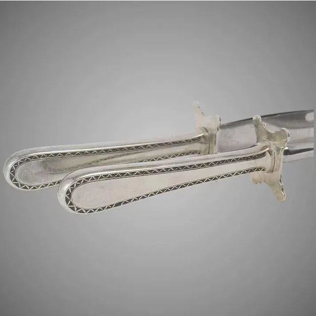 This is a fabulous, Large, heavy carving knife and fork with weighted Sterling silver handles and stainless steel blades...