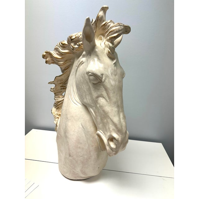 Dramatic vintage plaster horse head sculpture in like new condition. Measures 27” h x 9” x 20” Ivory with gold highlights....