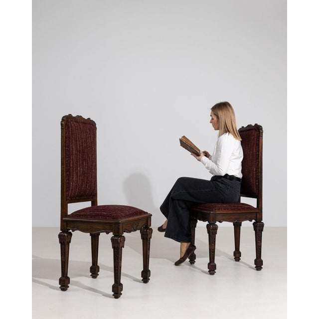 Here is a dining chair, its dark carved wood crest, burgundy striped upholstery the first thing to catch the eye. The...
