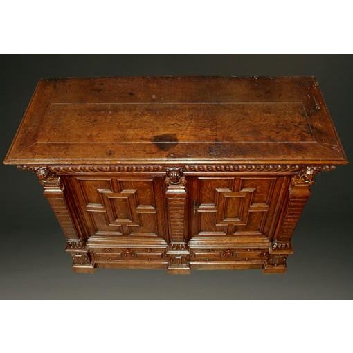 An impressive 17th-century Flemish antique buffet, hand-carved from oak and dating to circa 1650. One of the oldest cased...