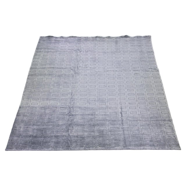 Beautiful modern Ikat hand-knotted wool rug with a gray-silver color field. This piece has a gorgeous all-over geometric...