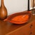 This large glazed ceramic centerpiece bowl is straight from Italy in the 1960s/70s. Its long, shuttle-shaped silhouette,...