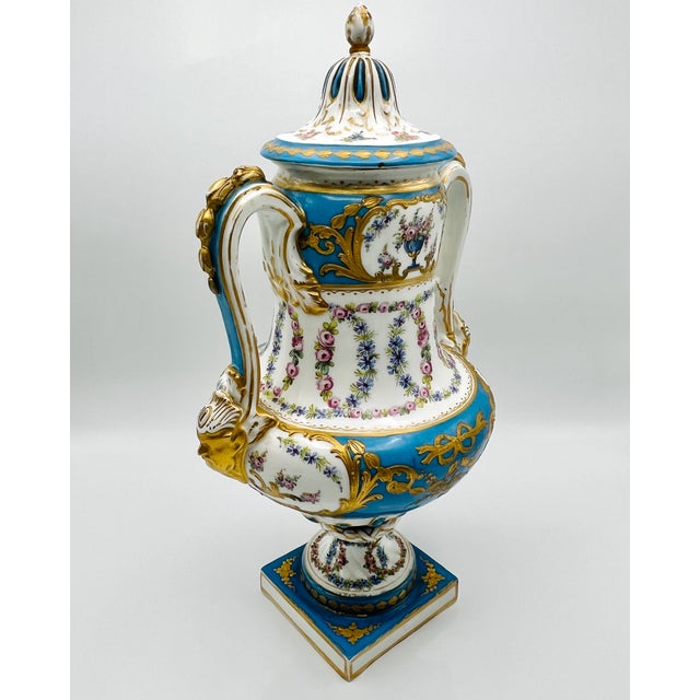 A rare 19th-century Sèvres-style porcelain urn, standing 41 cm tall and finished in a striking bleu céleste turquoise...