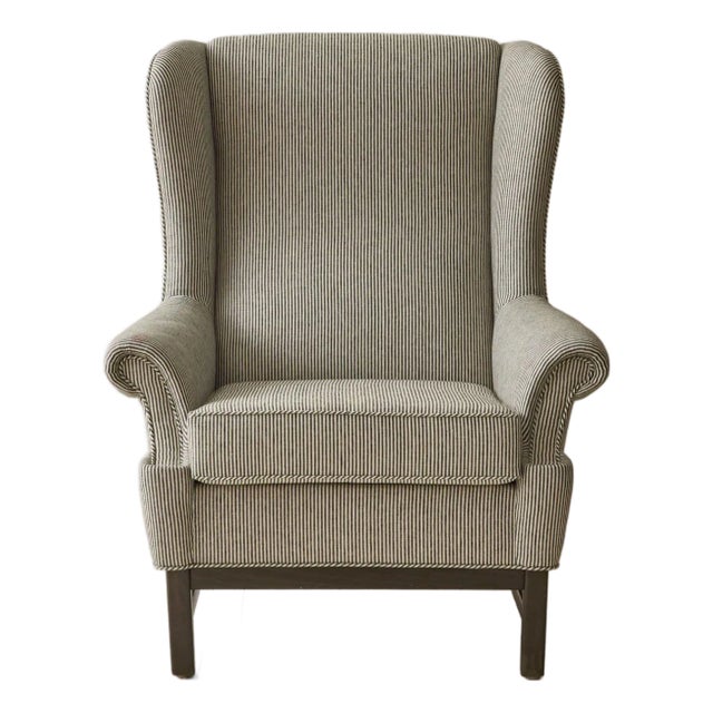 Ragnar Helsén for Svenskt Tenn, ear-flap (wingback) chair, Sweden, 1960s. A classic silhouette defined by softly curved...