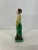 Small single Chinese export pottery figurine with green and yellow glaze decoration.