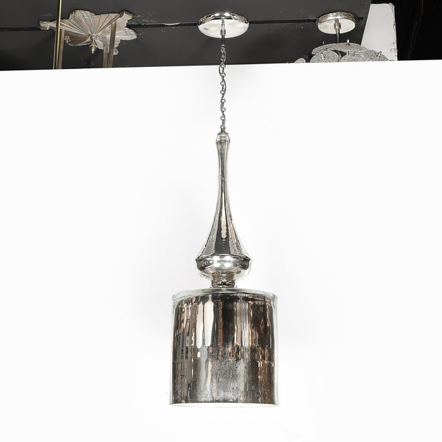 This Modernist hand-blown Murano mercury glass pendant chandelier, crafted in Italy during the 20th century, is a striking...