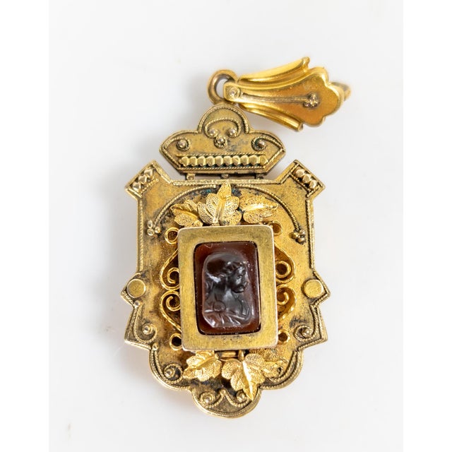 We are selling this very pretty Victorian Etruscan revival gold filled locket. This locket has elegant design with a...