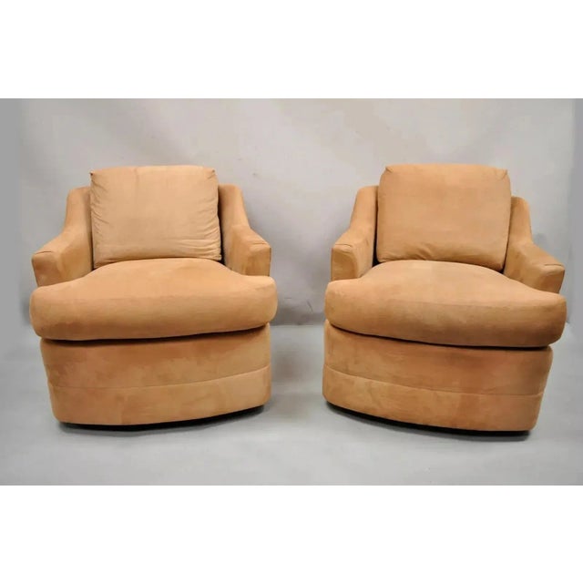 Vintage Mid Century Modern Brown Upholstered Swivel Lounge Club Chairs - a Pair. Item features a round swivel pedestal...