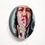 This circular oil painting presents a close-up of a figure with a finger raised to their lips, evoking a sense of secrecy...
