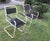 Mid century pair of painted iron and wood garden or patio chairs.