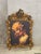 A spectacular French Rococostyle decorative portrait frame, richly sculpted with elaborate scrollwork, floral vines,...