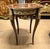An exquisite French Louis XV style accent table showcasing a beautifully crafted marquetry top, elegant cabriole legs, and...